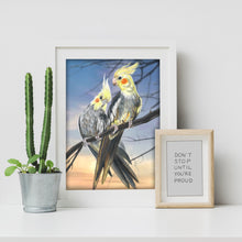 Load image into Gallery viewer, Cockatiel drawing in a white frame. Two cockatiel birds framed as desk art.
